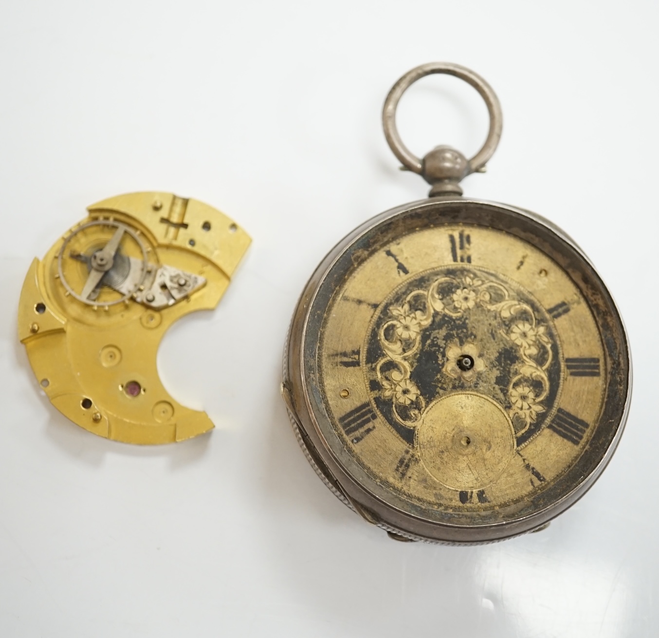 A collection of pocket watch cases (some silver), movements, dials and parts. Condition - poor